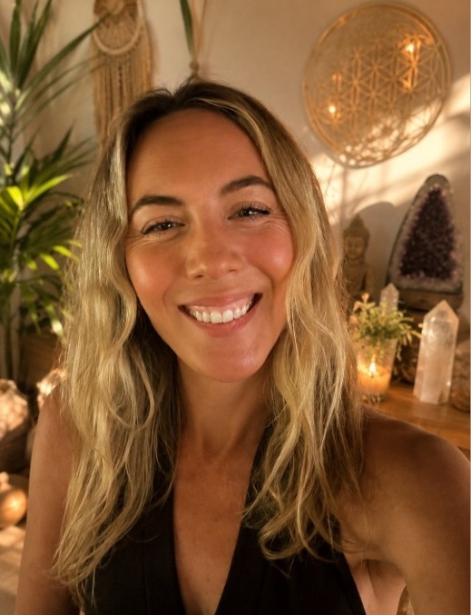 Amy Shaw smiling in her healing space
